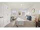 Bright and airy main bedroom with a king-size bed and sitting area at 237 Epping St # 89, Stockbridge, GA 30281