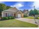 Houses with attached garages and well-maintained lawns at 450 Little Creek Rd, Lawrenceville, GA 30045