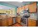 Kitchen with granite countertops and stainless steel appliances at 450 Little Creek Rd, Lawrenceville, GA 30045