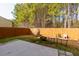 Spacious backyard with patio, wood fence, and mature trees at 4505 Ravenwood Dr, Union City, GA 30291