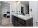 Double vanity bathroom with granite countertops and a view into bedroom at 4505 Ravenwood Dr, Union City, GA 30291