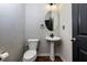 Small bathroom with pedestal sink and toilet at 4505 Ravenwood Dr, Union City, GA 30291