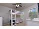 Cozy bedroom featuring a built-in bunk bed and ample natural light at 4505 Ravenwood Dr, Union City, GA 30291