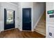 Entryway with dark doors and hardwood floors at 4505 Ravenwood Dr, Union City, GA 30291