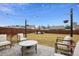 Spacious backyard with patio furniture and string lights at 824 Lakehaven Ln, Loganville, GA 30052