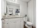 Main bathroom with granite countertop and a shower/tub combo at 824 Lakehaven Ln, Loganville, GA 30052