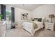 Bright bedroom with a queen-size bed, window, and neutral decor at 824 Lakehaven Ln, Loganville, GA 30052