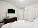 Bedroom with a queen-size bed, TV, and built-in closet at 824 Lakehaven Ln, Loganville, GA 30052