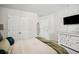 Bedroom with a queen bed, large TV, and plenty of closet space at 824 Lakehaven Ln, Loganville, GA 30052