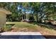 Spacious backyard with large grassy area and patio at 1003 Springdale Dr, Marietta, GA 30062