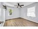 Simple bedroom with hardwood floors and ceiling fan at 1003 Springdale Dr, Marietta, GA 30062
