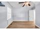 Spacious bedroom featuring wood floors and a ceiling fan at 1003 Springdale Dr, Marietta, GA 30062