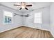 Bright bedroom with wood flooring, ceiling fan, and large windows at 1003 Springdale Dr, Marietta, GA 30062