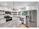Modern kitchen with stainless steel appliances and granite countertops at 1003 Springdale Dr, Marietta, GA 30062