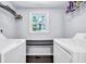 Clean laundry room with shelving and built-in countertop at 1003 Springdale Dr, Marietta, GA 30062