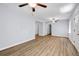 Bright living room featuring hardwood floors and multiple ceiling fans at 1003 Springdale Dr, Marietta, GA 30062