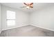 Spacious bedroom with ceiling fan and grey carpet at 406 River Chase Dr, Jonesboro, GA 30238