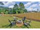 Fenced backyard with firepit, picnic table, and playground at 704 Fairgate Rd, Marietta, GA 30064