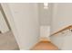 Clean carpeted basement stairs with a simple wooden handrail at 704 Fairgate Rd, Marietta, GA 30064