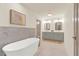 Bathroom with double vanity, soaking tub and hexagonal tile floor at 704 Fairgate Rd, Marietta, GA 30064