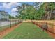 Community dog park with benches and fencing at 704 Fairgate Rd, Marietta, GA 30064