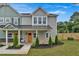 Two-story townhome with inviting front porch and landscaping at 704 Fairgate Rd, Marietta, GA 30064