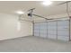 Spacious garage with overhead storage and a large door at 704 Fairgate Rd, Marietta, GA 30064