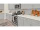 Modern kitchen with stainless steel appliances and gray cabinets at 704 Fairgate Rd, Marietta, GA 30064