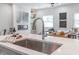 Modern kitchen sink and faucet with white countertops at 704 Fairgate Rd, Marietta, GA 30064