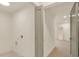 Simple laundry room with white walls and gray folding doors at 704 Fairgate Rd, Marietta, GA 30064