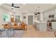 Open concept living area and kitchen with light wood floors at 704 Fairgate Rd, Marietta, GA 30064