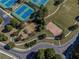 Aerial view showing tennis courts, playground, basketball court, and open green space at 924 Woodbury Rd, Canton, GA 30114