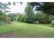 Spacious backyard providing ample green space at 2080 Misty Oaks Dr, Buford, GA 30519