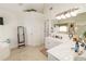 Bathroom with double vanity and a corner soaking tub at 2080 Misty Oaks Dr, Buford, GA 30519