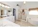 Large bathroom with double vanity, soaking tub, and shower at 2080 Misty Oaks Dr, Buford, GA 30519