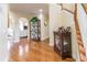 Hardwood floor entryway with a staircase and display cases at 2080 Misty Oaks Dr, Buford, GA 30519