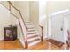 Two story entryway with hardwood floors and staircase at 2080 Misty Oaks Dr, Buford, GA 30519