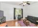 Bright Gathering room featuring hardwood floors and large windows at 2080 Misty Oaks Dr, Buford, GA 30519
