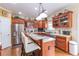 Kitchen boasts an island with seating and ample cabinetry at 2080 Misty Oaks Dr, Buford, GA 30519