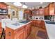 Island kitchen with stainless steel appliances and hardwood floors at 2080 Misty Oaks Dr, Buford, GA 30519