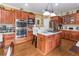 Well-equipped kitchen featuring stainless steel appliances and hardwood floors at 2080 Misty Oaks Dr, Buford, GA 30519