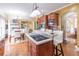 Open concept kitchen with island, stainless steel appliances and hardwood floors at 2080 Misty Oaks Dr, Buford, GA 30519