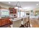 Kitchen features island with seating, stainless steel appliances and hardwood floors at 2080 Misty Oaks Dr, Buford, GA 30519