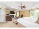 Main bedroom with fireplace, sitting area and large windows at 2080 Misty Oaks Dr, Buford, GA 30519