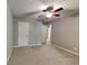 Carpeted bedroom featuring a ceiling fan and neutral walls at 3337 Devaughn Ne Dr, Marietta, GA 30066