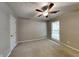 Inviting bedroom with neutral walls, carpet flooring, and a ceiling fan at 3337 Devaughn Ne Dr, Marietta, GA 30066
