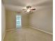 Cozy bedroom with carpet flooring, neutral walls, a ceiling fan, and a window at 3337 Devaughn Ne Dr, Marietta, GA 30066