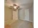 This spacious bedroom features a ceiling fan, neutral paint, and carpeted floors at 3337 Devaughn Ne Dr, Marietta, GA 30066