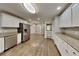 Bright kitchen with white cabinetry, stainless steel appliances, and an adjoining dining area at 3337 Devaughn Ne Dr, Marietta, GA 30066