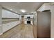 Spacious kitchen featuring white cabinets, granite countertops, stainless steel appliances and wood floors at 3337 Devaughn Ne Dr, Marietta, GA 30066